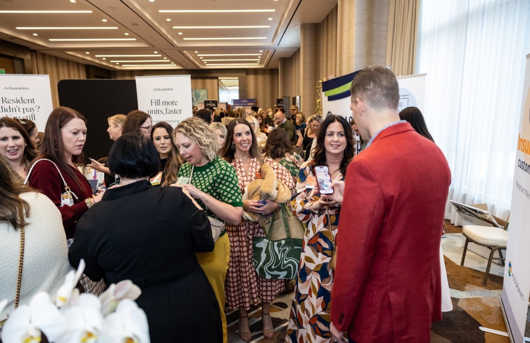 people posing at a tradeshow