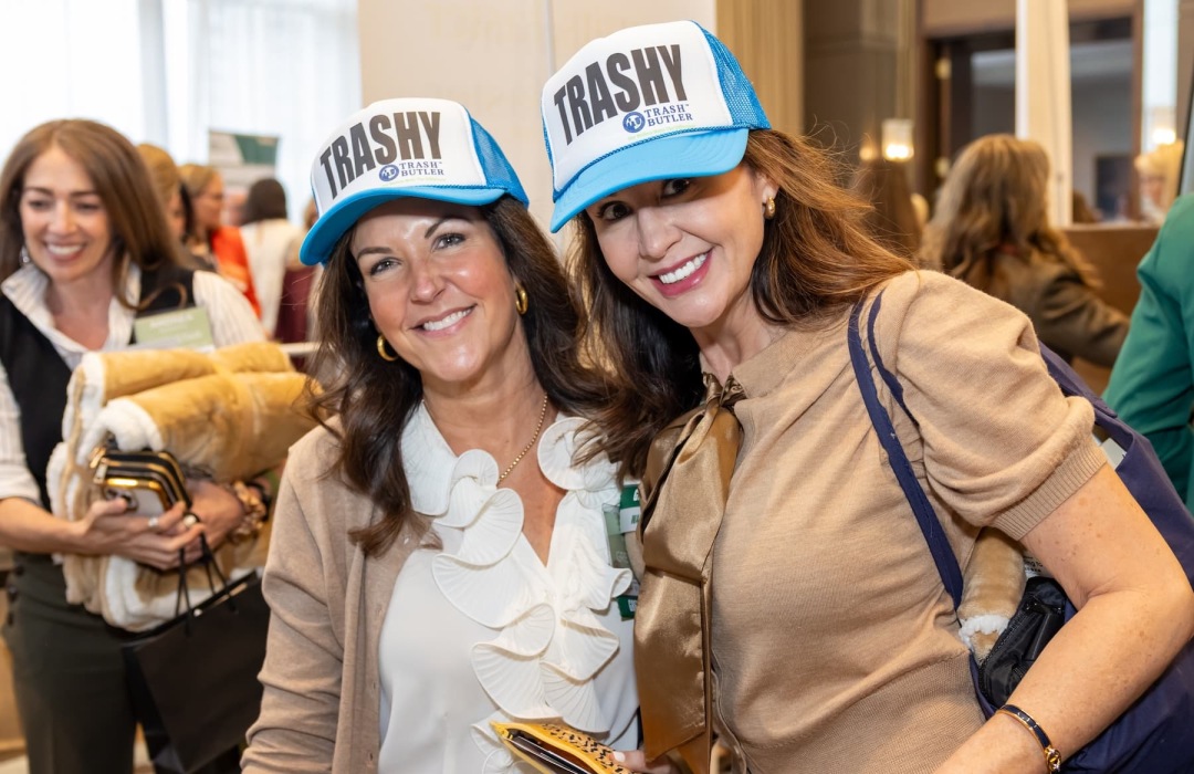 people posing at a tradeshow