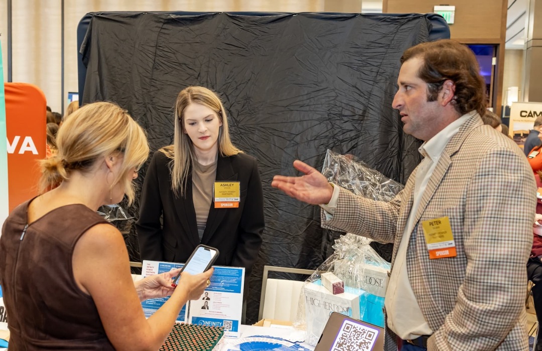 people posing at a tradeshow