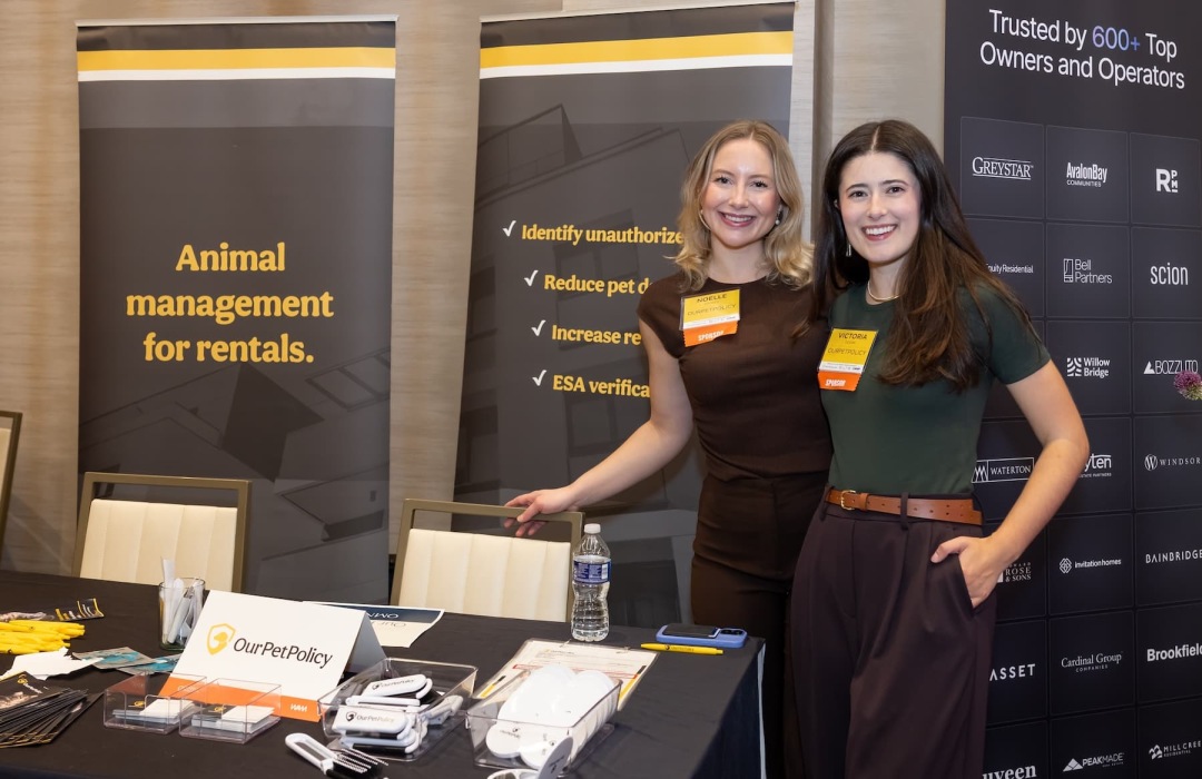 people posing at a tradeshow