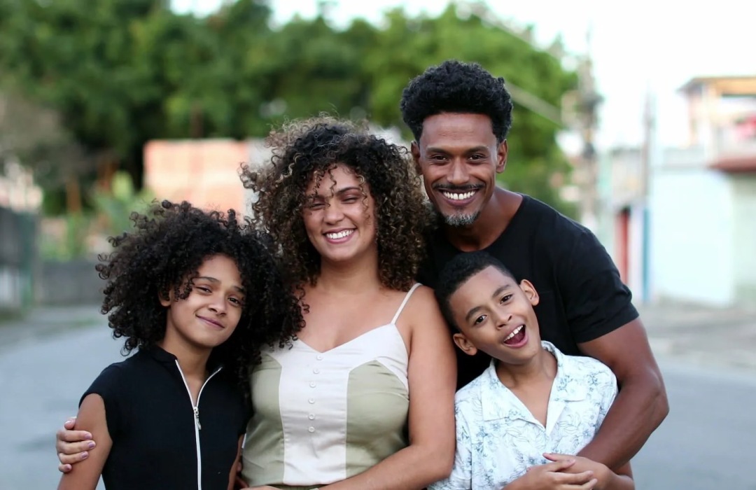 families and children smiling outdoors