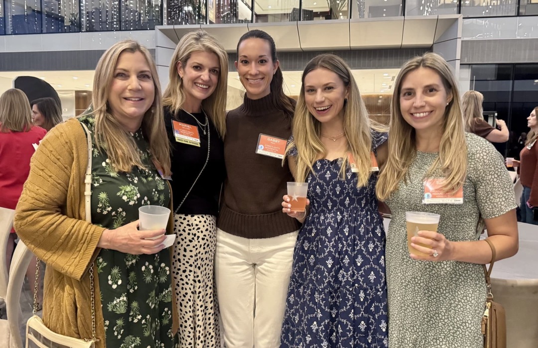 images of women posing at a conference