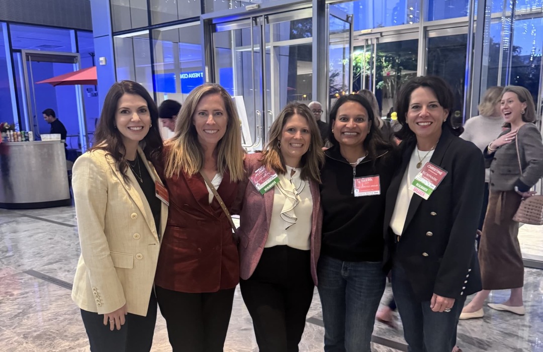 images of women posing at a conference