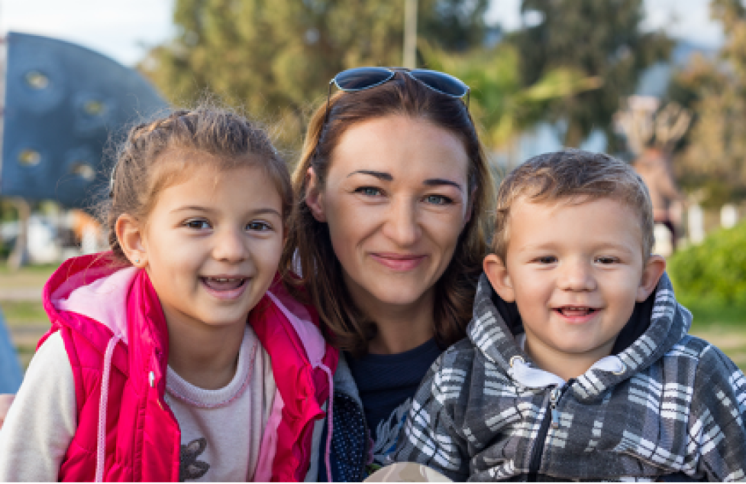 families and children smiling outdoors